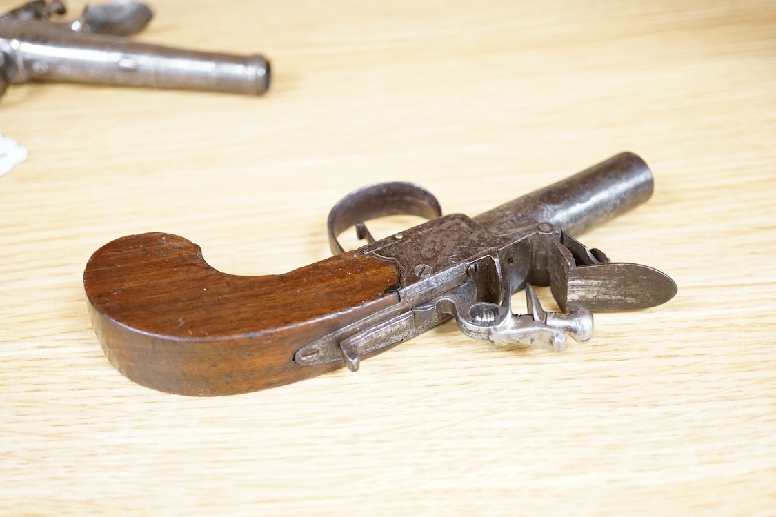 A boxlock flintlock pocket pistol with turn off barrel, Birmingham proved, frame engraved; Salmon and co., sliding safety catch